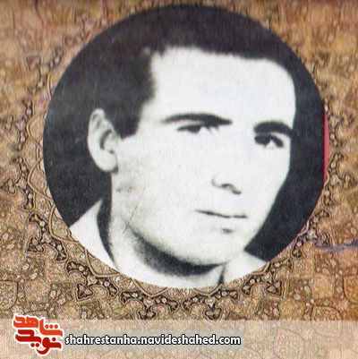 شهیدی که بروی دیوار شعارنویسی می‌کرد